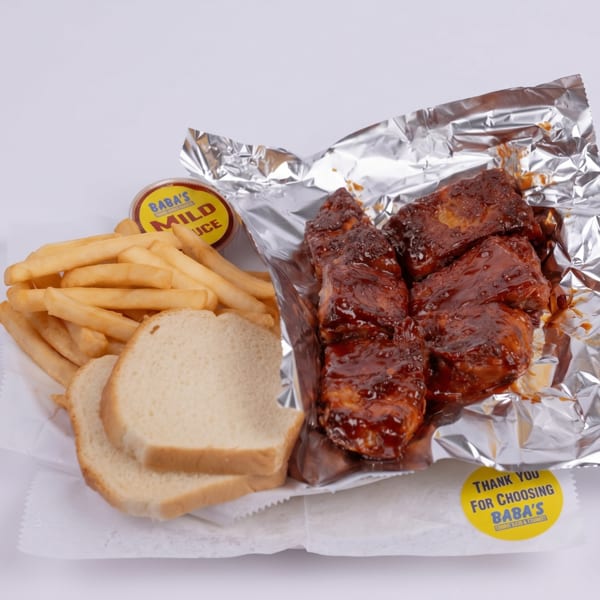 Baba's mild sauce, fries, white bread, and BBQ ribs in foil on a white background.