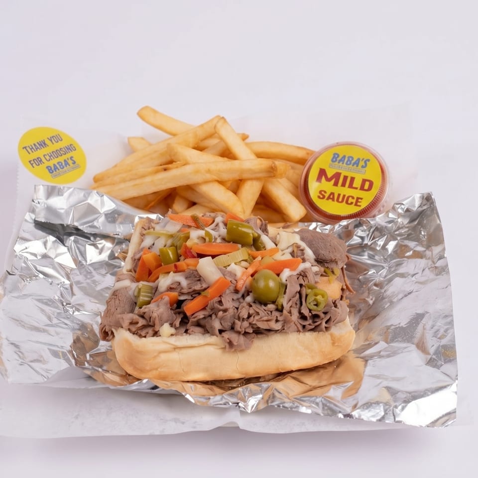 Baba's Italian beef sandwich with giardiniera, fries, and mild sauce on foil.